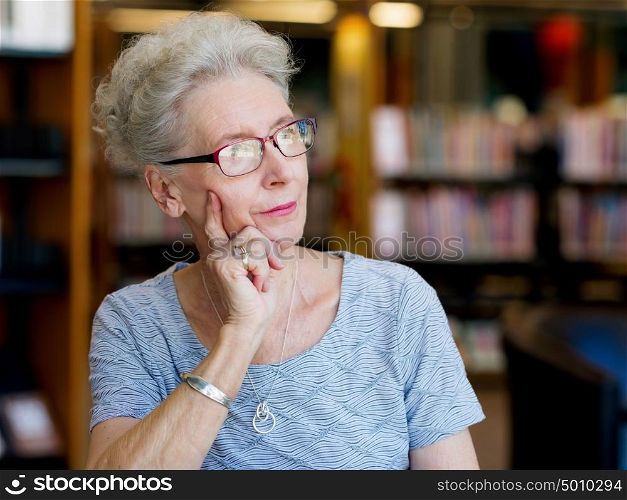 Portrait of elderly lady thinking something. Dreaming new project