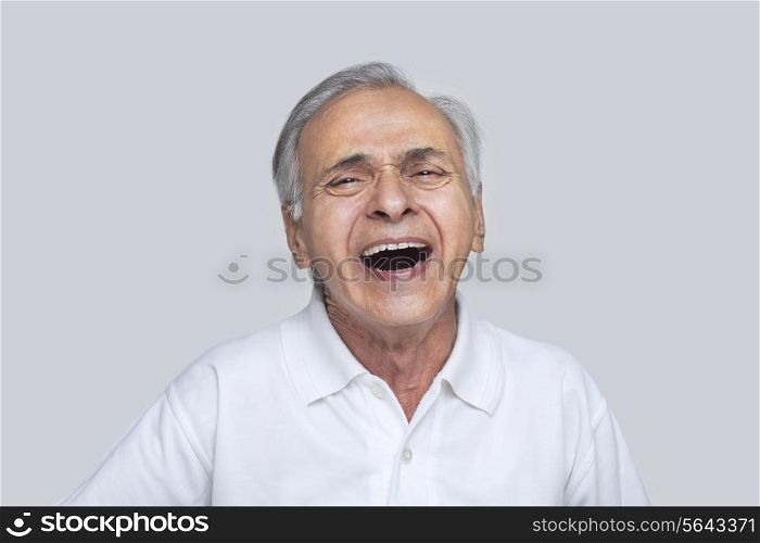 Portrait of elderly man laughing