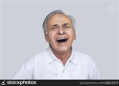 Portrait of elderly man laughing