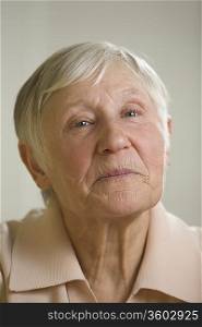 Portrait of elderly woman with short grey hair