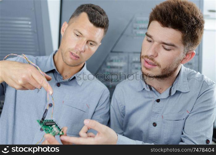 portrait of electronics technicians at work