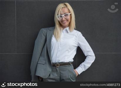 Portrait of elegantly dressed mature gorgeous blond business woman outdoor