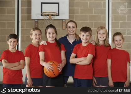 Portrait Of Elementary School Basketball Team With Coach