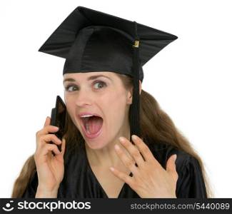 Portrait of excited graduation student girl speaking phone