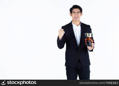 Portrait of Excited overjoyed successful feeling winner screaming handsome young Asian businessman holding a champion cup isolated on white grey blank copy space studio background,Business success.