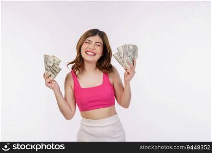 Portrait of excited young woman holding bunch of dollars banknotes isolated over white background. Wealth, people and lifestyle concept.