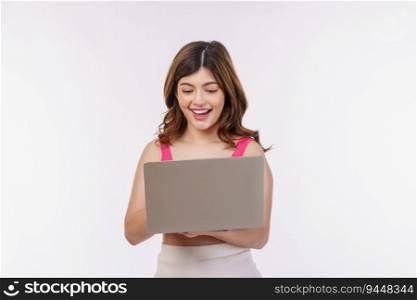 Portrait of excited young woman working on laptop computer isolated over white background. Business, people and technology concept.