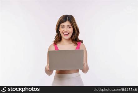 Portrait of excited young woman working on laptop computer isolated over white background. Business, people and technology concept.