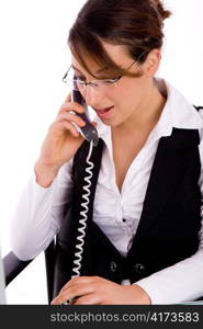 portrait of executive busy on phone against white background