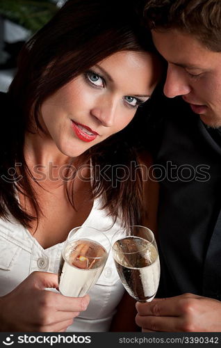 Portrait of extravagant man and woman with glass of champagne