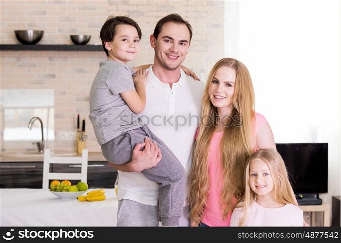 Portrait of family at home. Portrait of happy family with two children at home