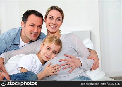 Portrait of family expecting new baby to come
