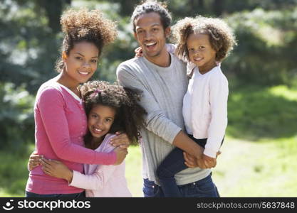Portrait Of Family Group In Countryside Together