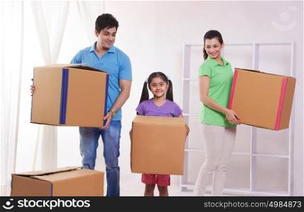 Portrait of family moving into new home