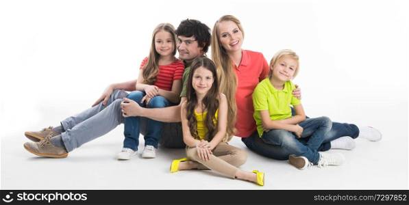Portrait of family of parents and three children studio isolated on white background. Portrait of family with children