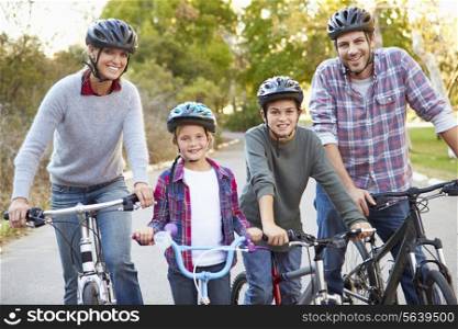Portrait Of Family On Cycle Ride In Countryside