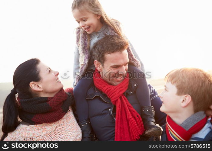 Portrait Of Family On Winter Beach