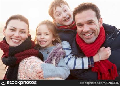 Portrait Of Family On Winter Beach