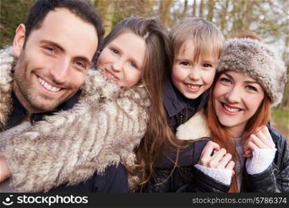Portrait Of Family On Winter Countryside Walk Together