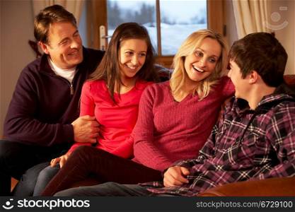 Portrait Of Family Relaxing On Sofa Together