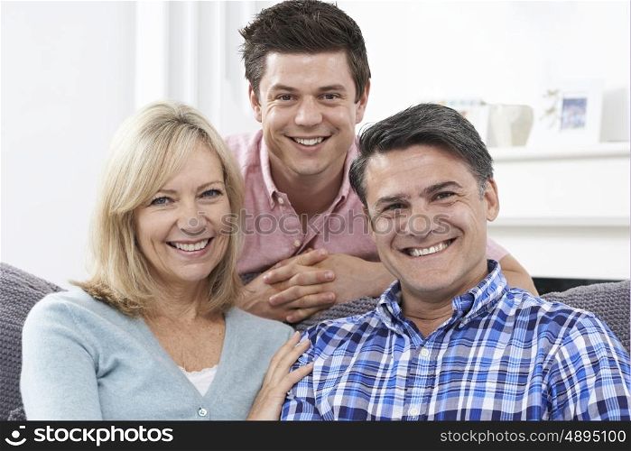 Portrait Of Family With Adult Son At Home