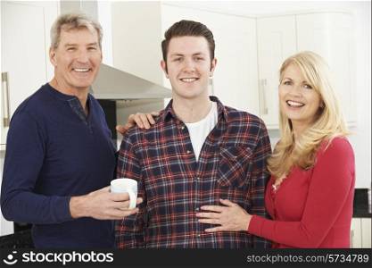 Portrait Of Family With Adult Son At Home