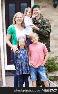 Portrait Of Family With Army Father Home On Leave