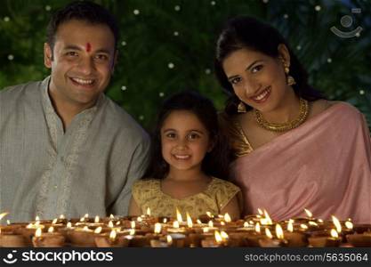 Portrait of family with diyas