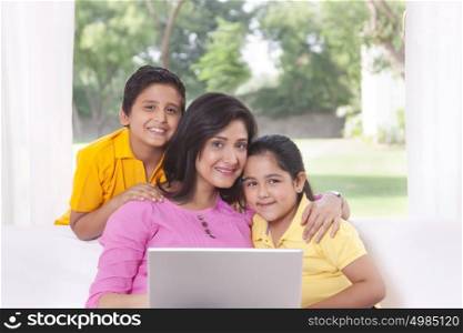 Portrait of family with laptop