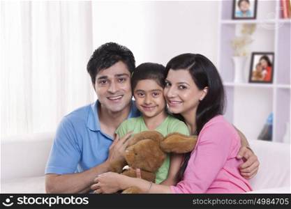 Portrait of family with stuffed toy