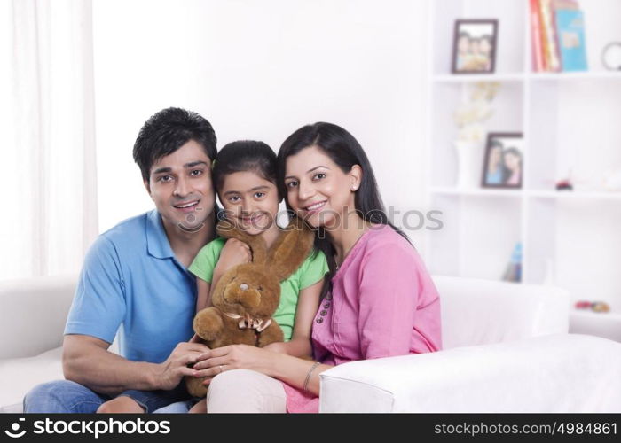 Portrait of family with stuffed toy