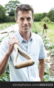 Portrait Of Farm Workers In Organic Field