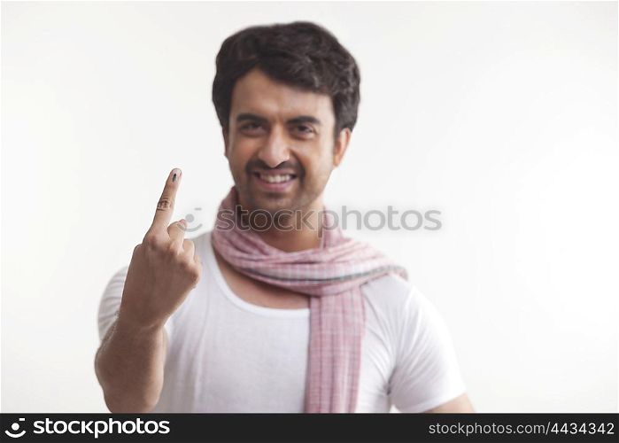 Portrait of farmer with voters mark on finger