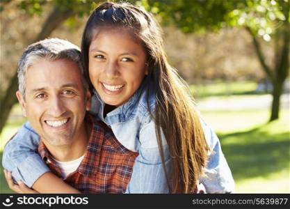 Portrait Of Father And Daughter In Countryside