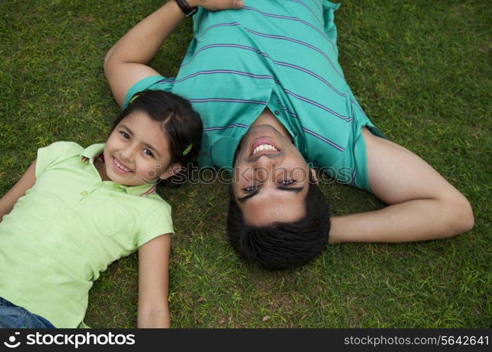 Portrait of father and daughter smiling