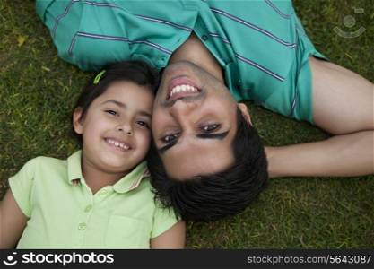 Portrait of father and daughter smiling