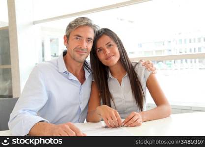 Portrait of father and girl in real-estate agency