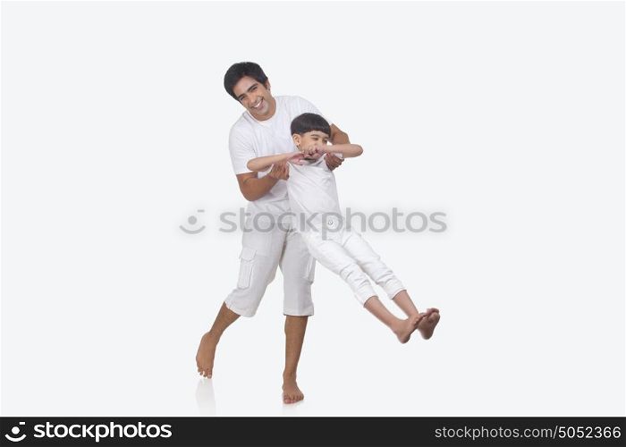 Portrait of father and son enjoying