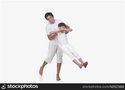 Portrait of father and son enjoying