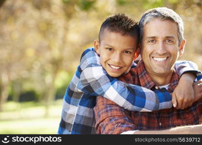 Portrait Of Father And Son In Countryside