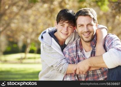 Portrait Of Father And Son In Countryside