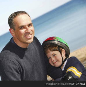 Portrait of father and son outside