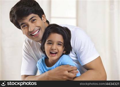 Portrait of father and son smiling