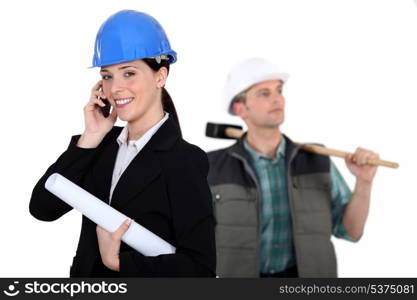 portrait of female architect making a call