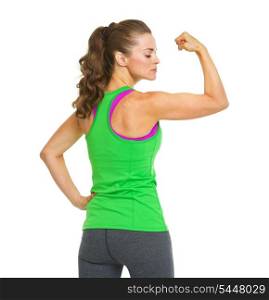 Portrait of female athlete showing biceps