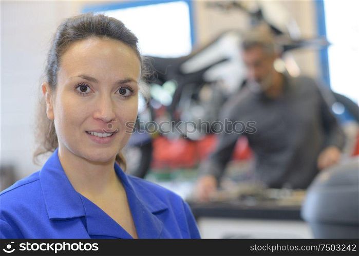 portrait of female auto repair worker