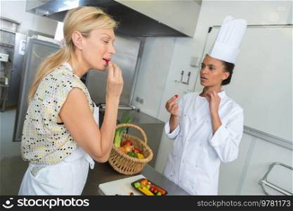 portrait of female chef tasting