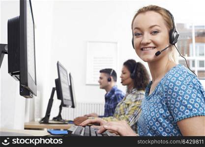 Portrait Of Female Customer Services Agent In Call Centre
