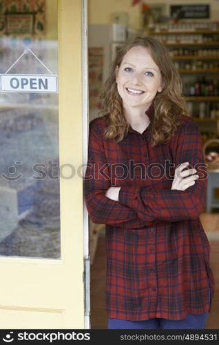 Portrait Of Female Delicatessen Owner Outside Store