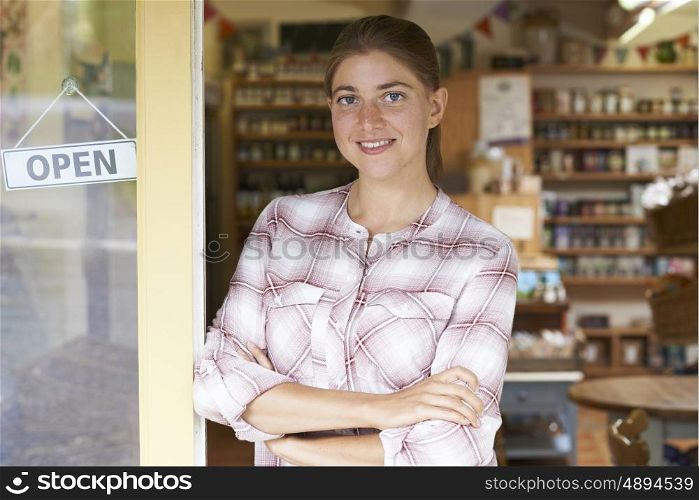 Portrait Of Female Delicatessen Owner Outside Store